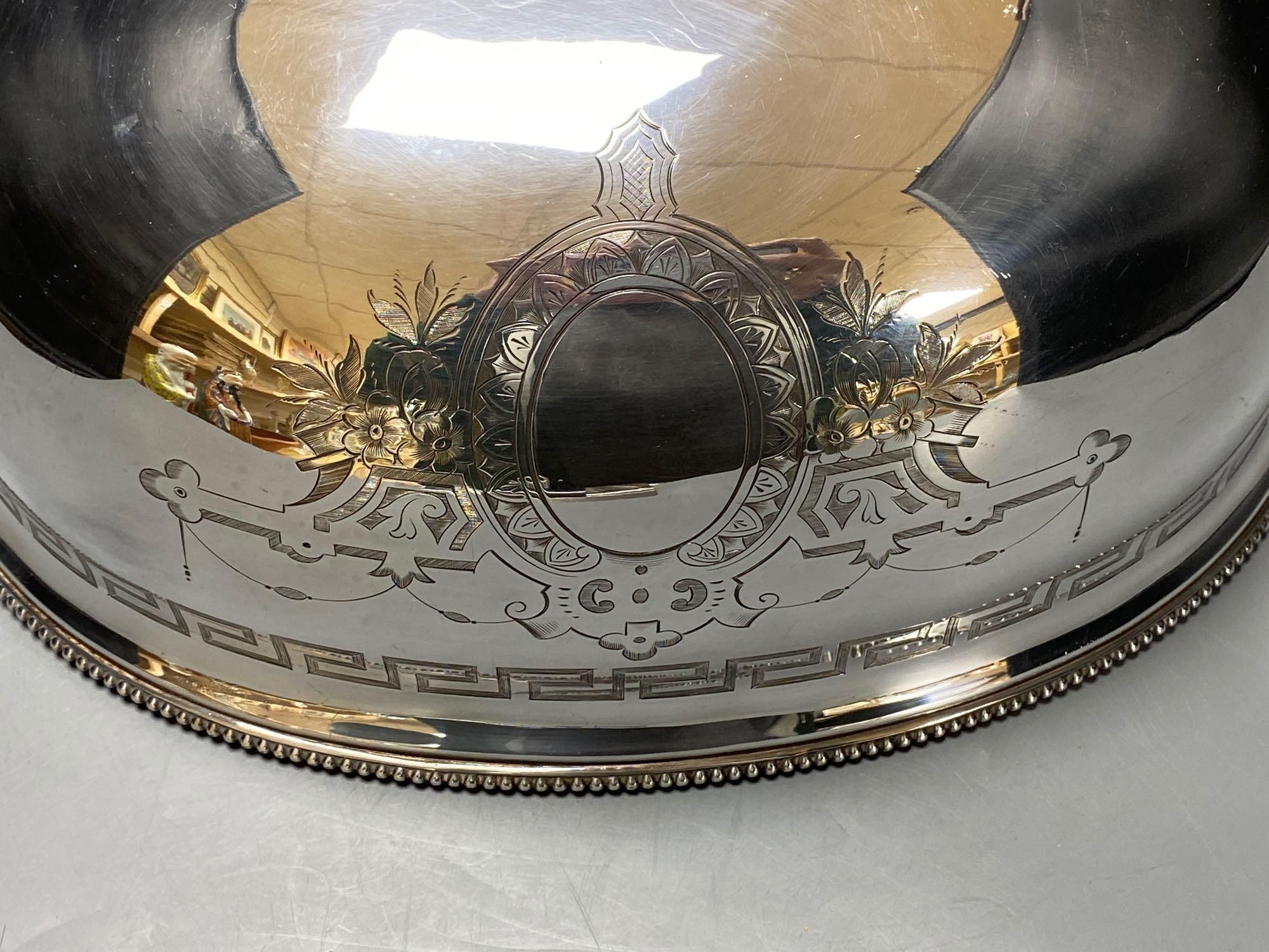 A silver plated engraved meat dome, width 33cm